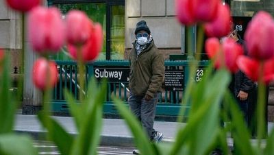 Man in mask by subway stop from coronavirus