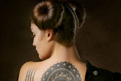 mandala tattoo on woman's back